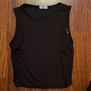 Cute camisole with hole on the side! Hardly ever worn. Perfect for festivals